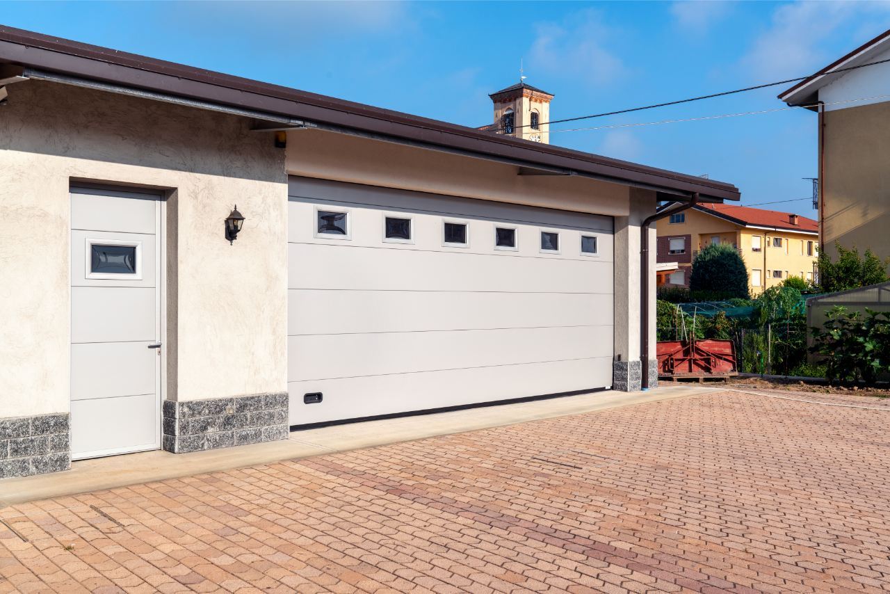 Iridium Doors Sezionale Residenziale e portina pedonale SOLE 24